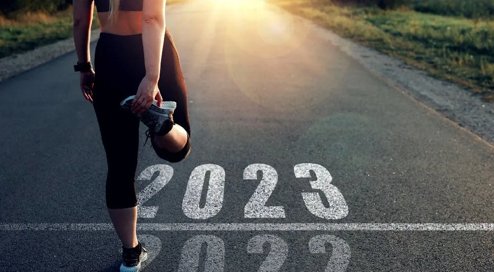 Mujer ejercitandose, propósitos Año nuevo
