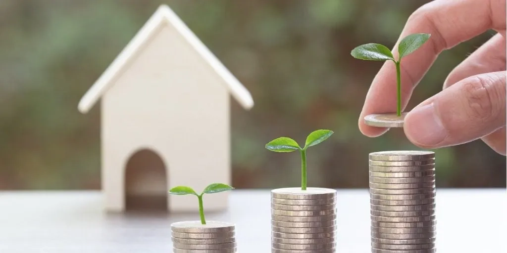 Dinero creciendo y una casa, invertir en bienes raíces